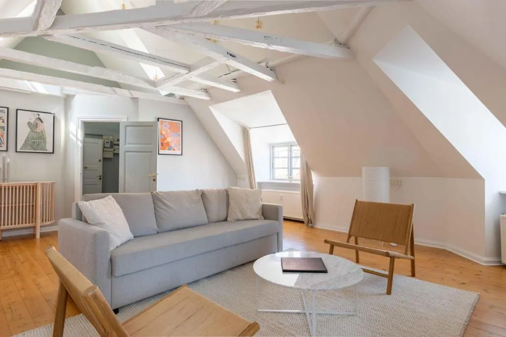 Image of Unique Apartment w Exposed Beams Next to Tivoli